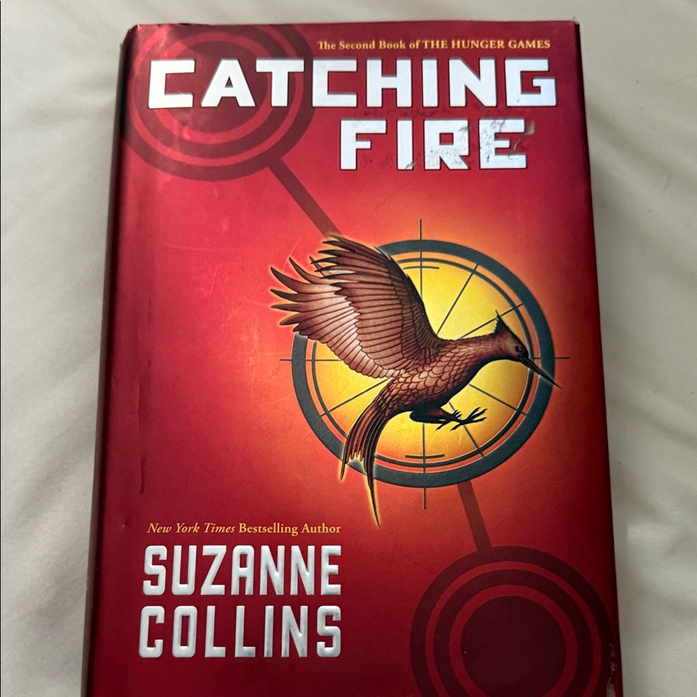Catching Fire by Suzanne Collins - Red Hardcover